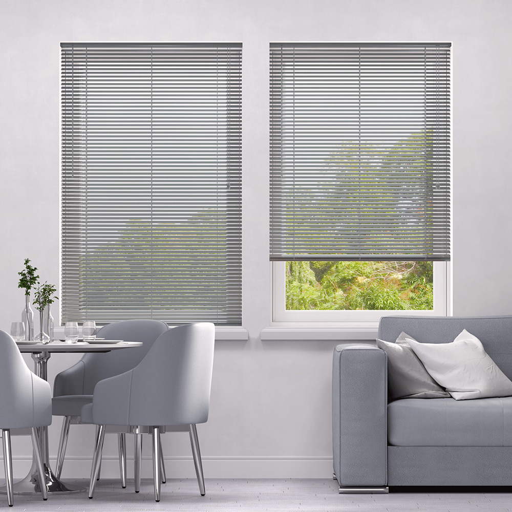 Grey aluminium Venetian blinds in slimline style against window in grey living area