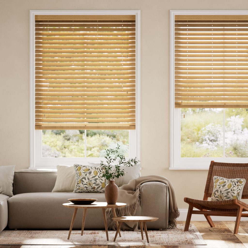 Cedar coloured timber Venetian blinds with beige coloured lounge suit and chair in living room setting